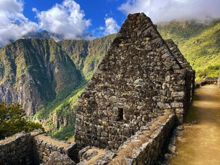 Landscape of the stunning mountains of Machu Picchu covered in the fog in Peru