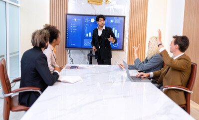 Employee on job corporate Business colleagues around the table look presentation from large screen