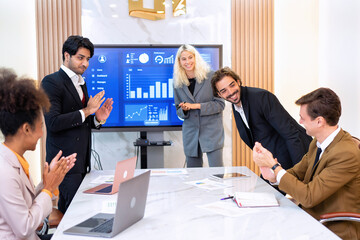 Employee on job corporate Business colleagues sit around table clapping hand for business success