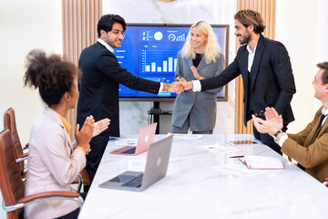 Team business meeting in room brainstorm together and Shaking hands for success operation winner