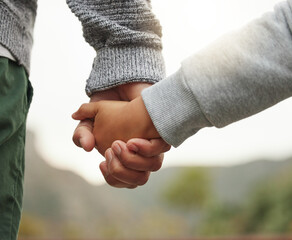 Shell always be my princess. an unrecognisable father holding his daughters hand in the garden.