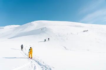 Fotobehang Ski alpinist going on the top of the mountain Lyngen Alps, Norway  © scottiniroberto