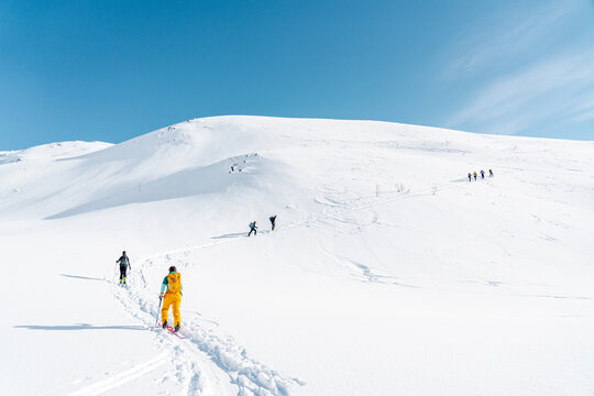 Ski alpinist going on the top of the mountain Lyngen Alps, Norway 