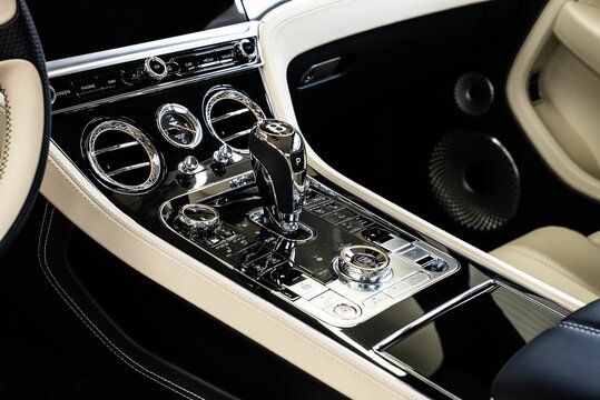 the center console and the dash buttons of a bentley vehicle