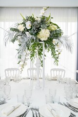 Beautiful bouquet of white flowers on the table prepared for a wedding ceremony.