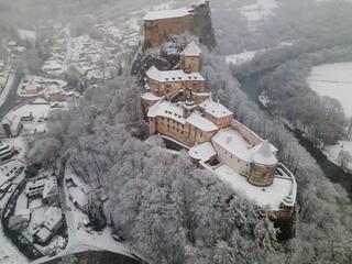 Aerial view of the Orava Castle on a snowy mountain in Slovakia