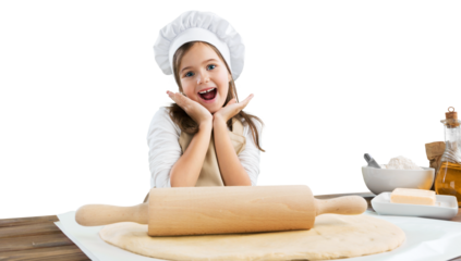 Happy child in chef costume stretch the dough