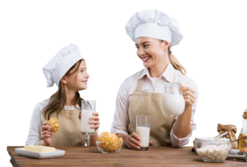 The beautiful young mother and her little daughter cooking