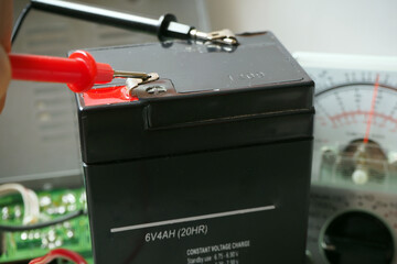 Testing valve regulated lead-acid 6 Volt battery. Full accumulator for UPS. 