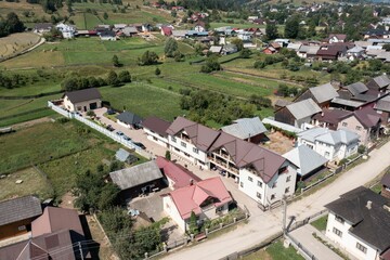 Fototapeta na wymiar Aerial landscape over a village with lands