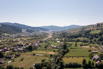 Fototapeta na wymiar Aerial landscape over a village with lands