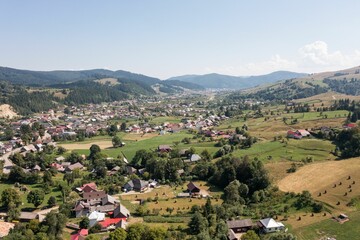 Aerial landscape over a village with lands