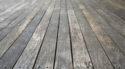 Old vintage planked wood table in perspective for background.