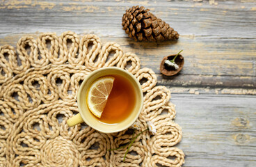 black tea with lemon on a wooden background. place for text