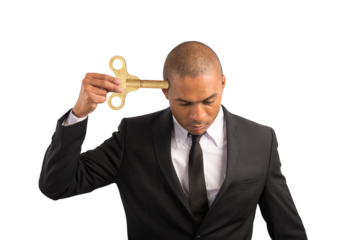 Weary  businessman recharge himself with a key due to overwork