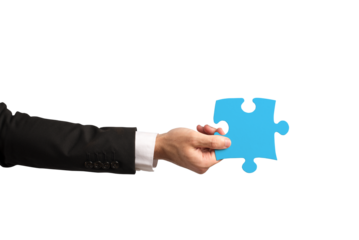 businessman holds a piece of puzzle as teamwork, partnership, integration concept