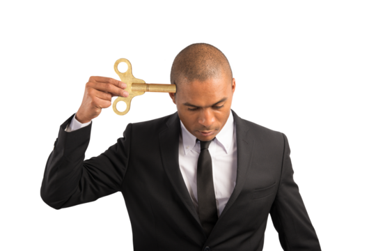 Weary  businessman recharge himself with a key due to overwork