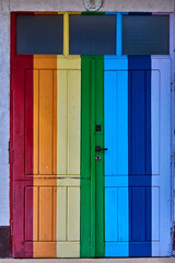 doors painted in the colors of the rainbow.