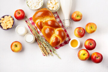 Fototapeta na wymiar Jewish Shavuot Holiday Card. Dairy Products, Apples, Cheese, Bread, Milk on White Background.