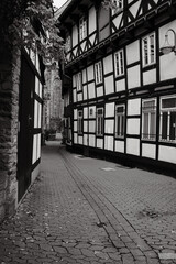 Vertical shot of Marktkirche from the parish courtyard with half-timbered houses in Goslar, Germany