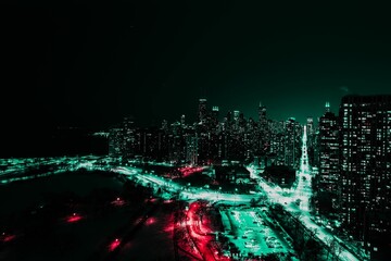 View of Chicago at night, showcasing the illuminated skyline of the city's towering skyscrapers