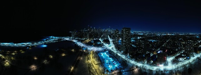 View of Chicago at night, showcasing the illuminated skyline of the city's towering skyscrapers