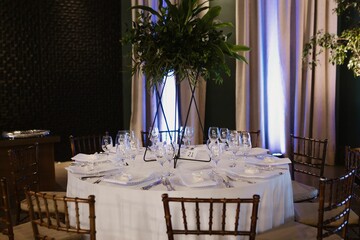 Interior of a restaurant decorated with flowers for a wedding celebration ceremony
