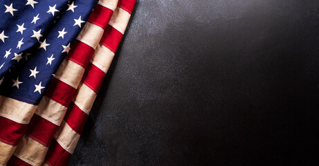 Fototapeta premium Happy Memorial day concept made from American flag on dark stone background.