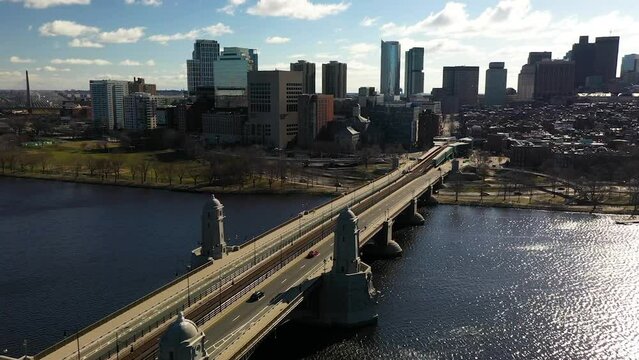 Aerial shot of the MBTA Redline approaching  Boston on the Longfellow Bridge