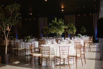 Interior of a restaurant decorated with flowers for a wedding celebration ceremony