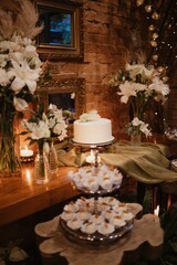 Variety of delicious desserts on trays on a table during a wedding celebration