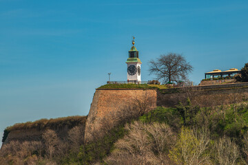 Fototapeta na wymiar The white Clock tower, one of the most significant landmarks and symbols of Petrovaradin Fortress and Novi Sad