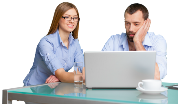 Business couple working on laptop sitting at desk