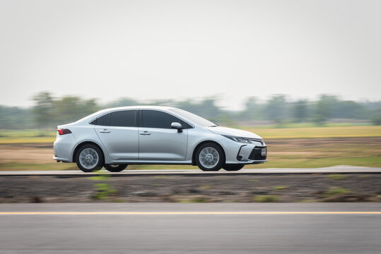 Nakhonsawan, Thailand - April 2023: Toyota Corolla Altis 1.8 V Hybrid moving fast on the road, on April 11, 2023, at Nakhonsawan, Thailand.
