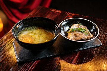 fish soup on a wooden table. restaurant menu concept