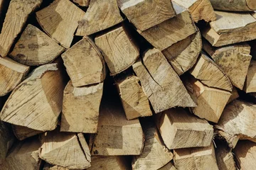 Foto op Plexiglas stocks of beech firewood for the winter © Надя Запара