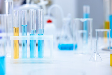 Chemistry experiment, science laboratory, flasks and test tubes contain different chemicals.