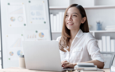 Confident Asian businesswoman calculating finances in the accounting and balance sheet work of the stock market and international exchange rates, Authorized Share Capital, Owners Equity, Common Stock