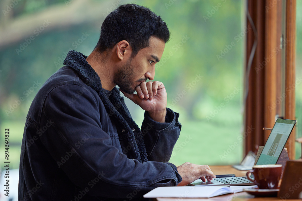 Poster i thought getting out the house would help me crack this. a man using his laptop while sitting in a 