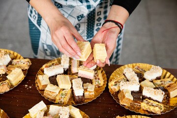 Closeup view of a woman making a cake.