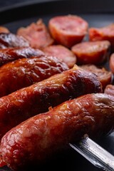 Row of assorted sausages on a skewer