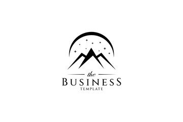 Mountain logo decorated with sparkling stars and crescent moon in flat design style © FendyTerisno