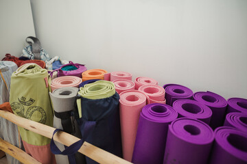 Raw of colorful mats in a yoga center