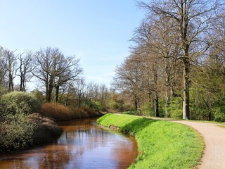 Fototapeta na wymiar River Grote Nete and a hiking trail in Westerlo, Belgium.