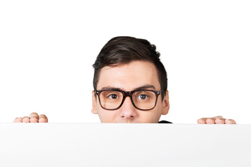 Man in glasses holding blank white paper over his face