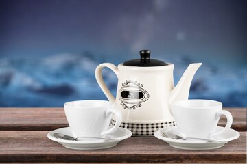 Tasty hot tea in cup in the sky background.