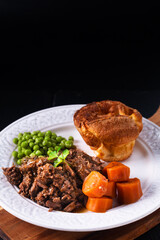 Food concept homemade Beer-Braised Shredded Beef with yorkshire pudding on black background with copy space