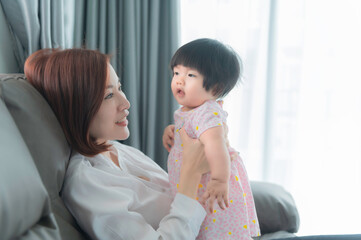 Mother and daughter newborn in home,Happy time of family,Single mom concept,Concept mother day