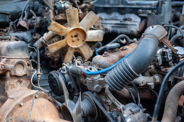 Industry recycle engine. old engine wreck kept for recycle. Machine technician separate and classification part of iron or steel car machine wreck.