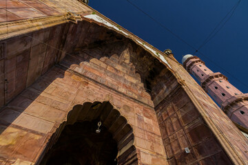 Entrance gate and towers of Taj ul masjid mosque in bhopal. Typical arches and structure design symbolising islamic arts and traditions. The halls are used for salah or namaz during eid or ramadan.